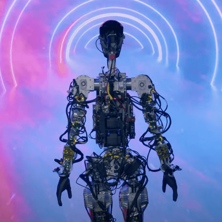 The Tesla Bot, Optimus, on a stage.