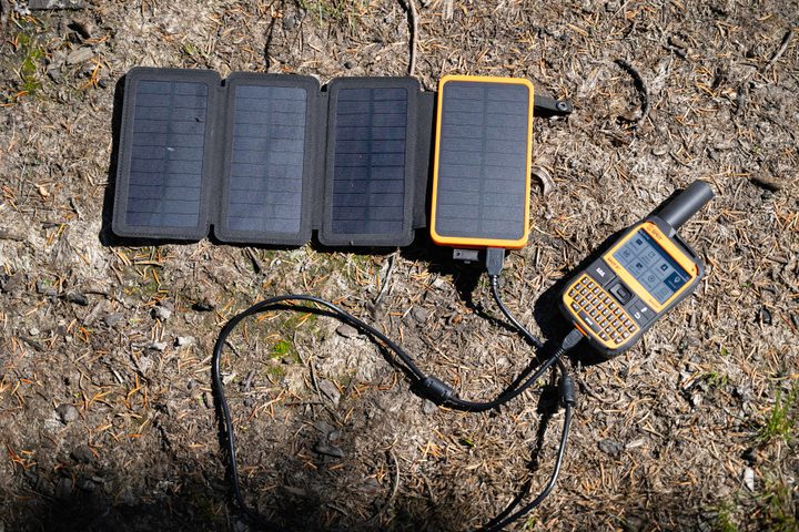 A solar powered battery charging the Spot X.