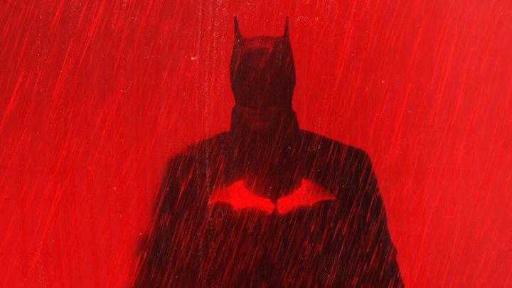 Robert Pattinson as the Dark Knight in red promo art for The Batman.