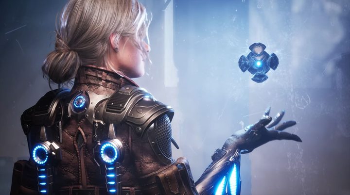 A playable character hold a mysterious orb in The First Descendant's gamescom trailer.