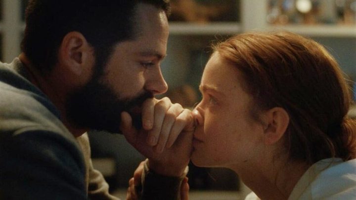 A man and a woman look at each other in All Too Well.