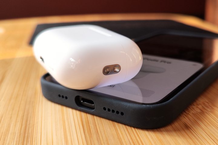 Apple AirPods Pro 2 charging case lanyard loop close-up.