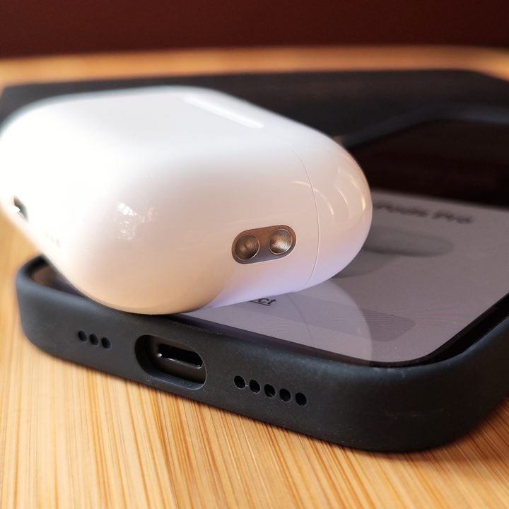 Apple AirPods Pro 2 charging case lanyard loop close-up.