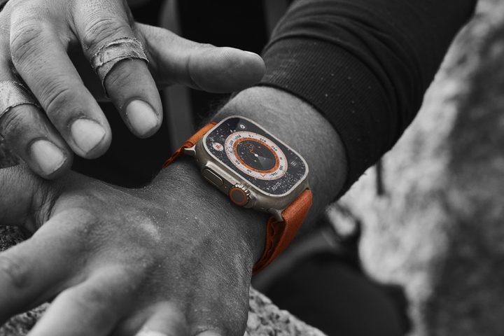 Someone wearing the Apple Watch Ultra while climbing.