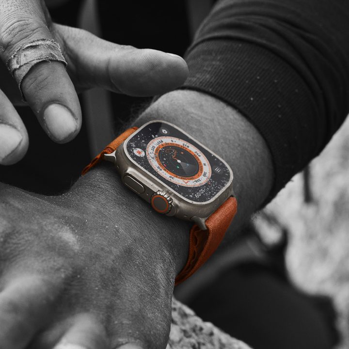 Someone wearing the Apple Watch Ultra while climbing.