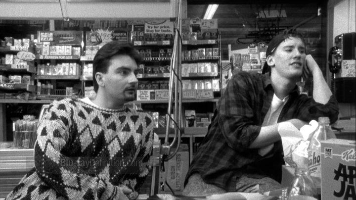 Two men stand in a convenience store in Clerks.
