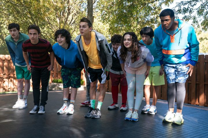 The young cast of Cobra Kai season 5 bow toward the camera.