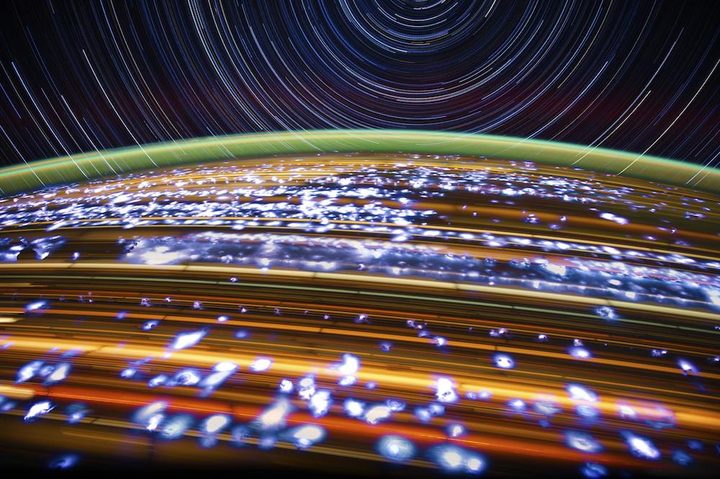 Trails of light from Earth and stars.