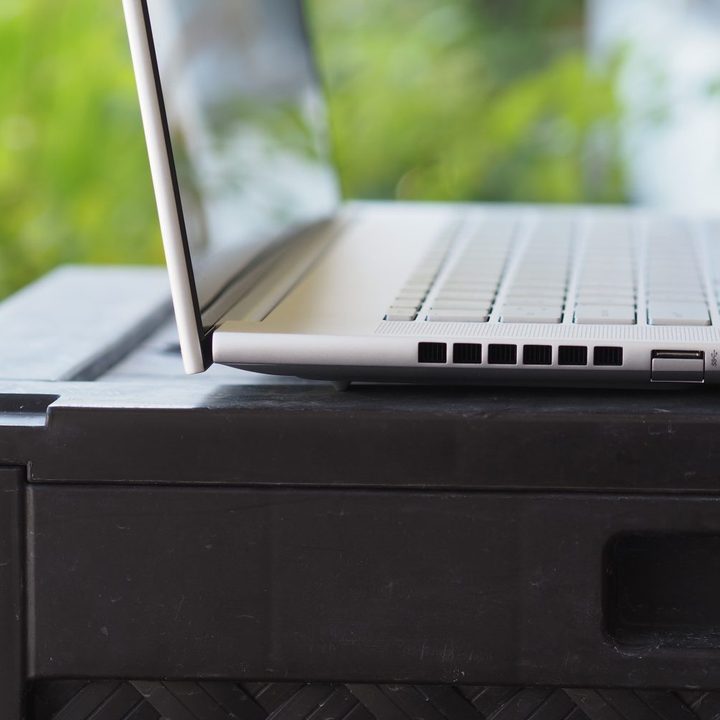 HP Envy 16 side view showing lid, ports, and vent.