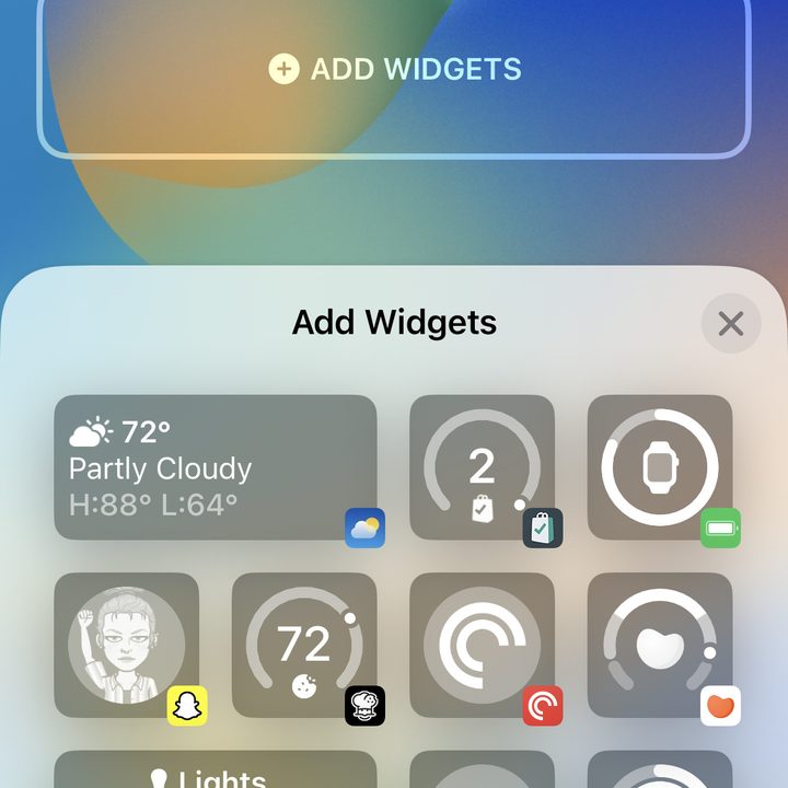 Adding widgets to an iOS 16 Lock Screen on an iPhone.