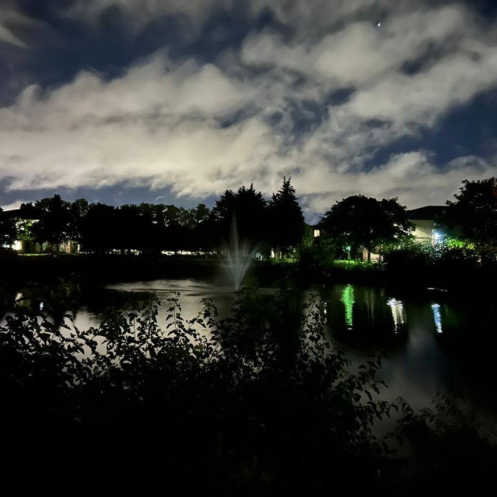 Photo of a pond at night, taken with the iPhone 14.