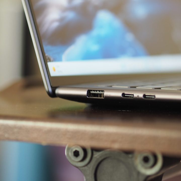 Lenovo Slim 7 Pro X side view showing ports and display.