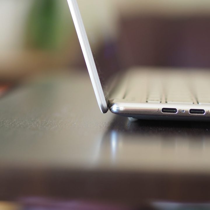 Lenovo Slim 9i side view showing lid and ports.