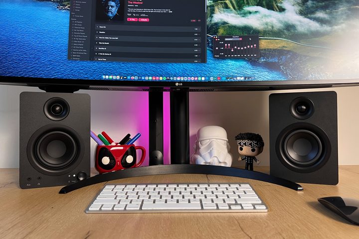 The Monoprice DT-3BT Powered Desktop Bluetooth Speakers with a desk setup.