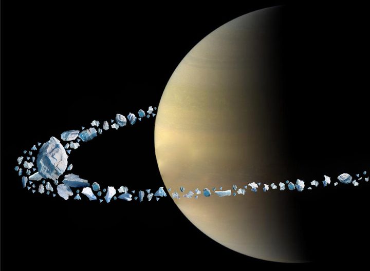 Artistic rendering of the moon Chrysalis disintegrating in Saturn’s intense gravity field. The chunks of icy rock eventually collided and shattered into smaller pieces that became distributed in the thin ring we see today.