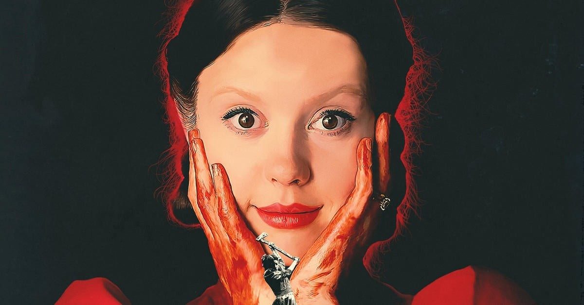 Mia Goth stares at the camera in the poster for Pearl.