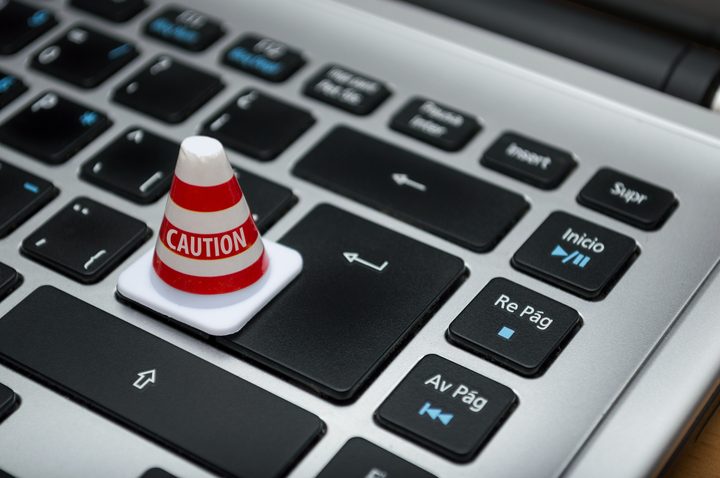 A keyboard with a miniature caution cone