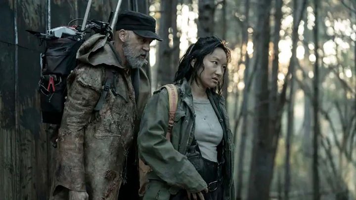 Dr. Everett and Amy stand outside in a scene from Tales of the Walking Dead.