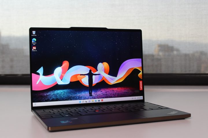 The ThinkPad Z13 open on a white table.