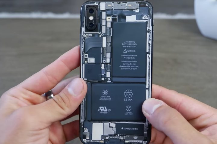 Modded iPhone X with transparent iPhone X rear panel.