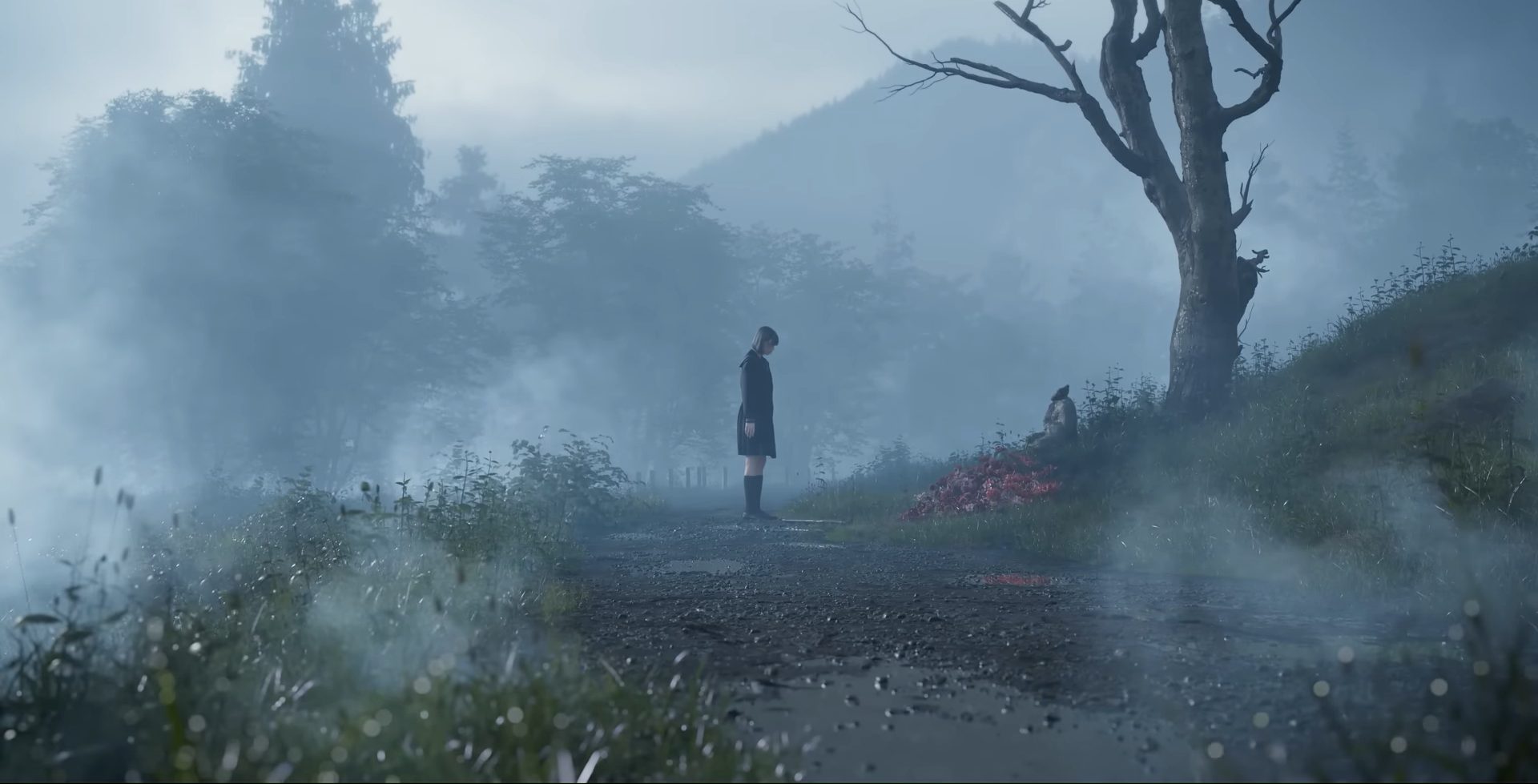 A girl staring at a shrine.