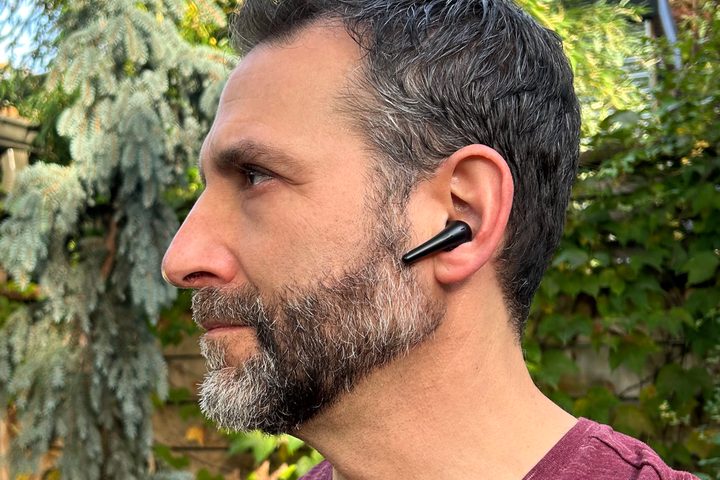 Man wearing 1More Aero wireless earbuds.