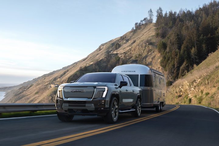 A 2024 GMC Sierra EV towing an Airstream trailer.