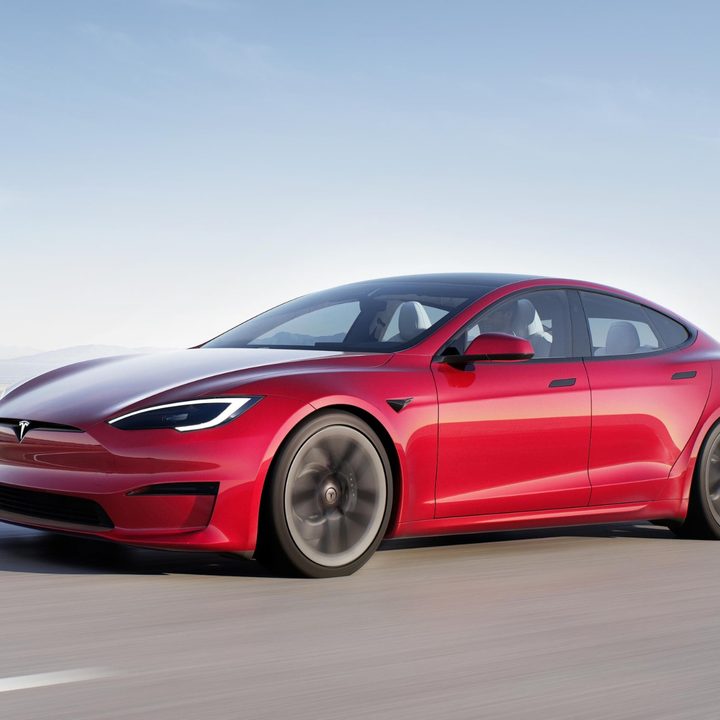 A Tesla Model Y is seen driving to the left.