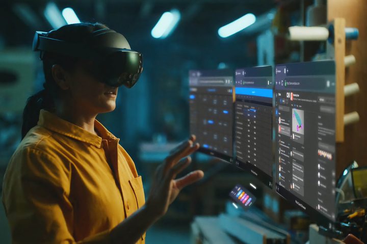 A person wearing a Meta Quest Pro headset interacts with VR.