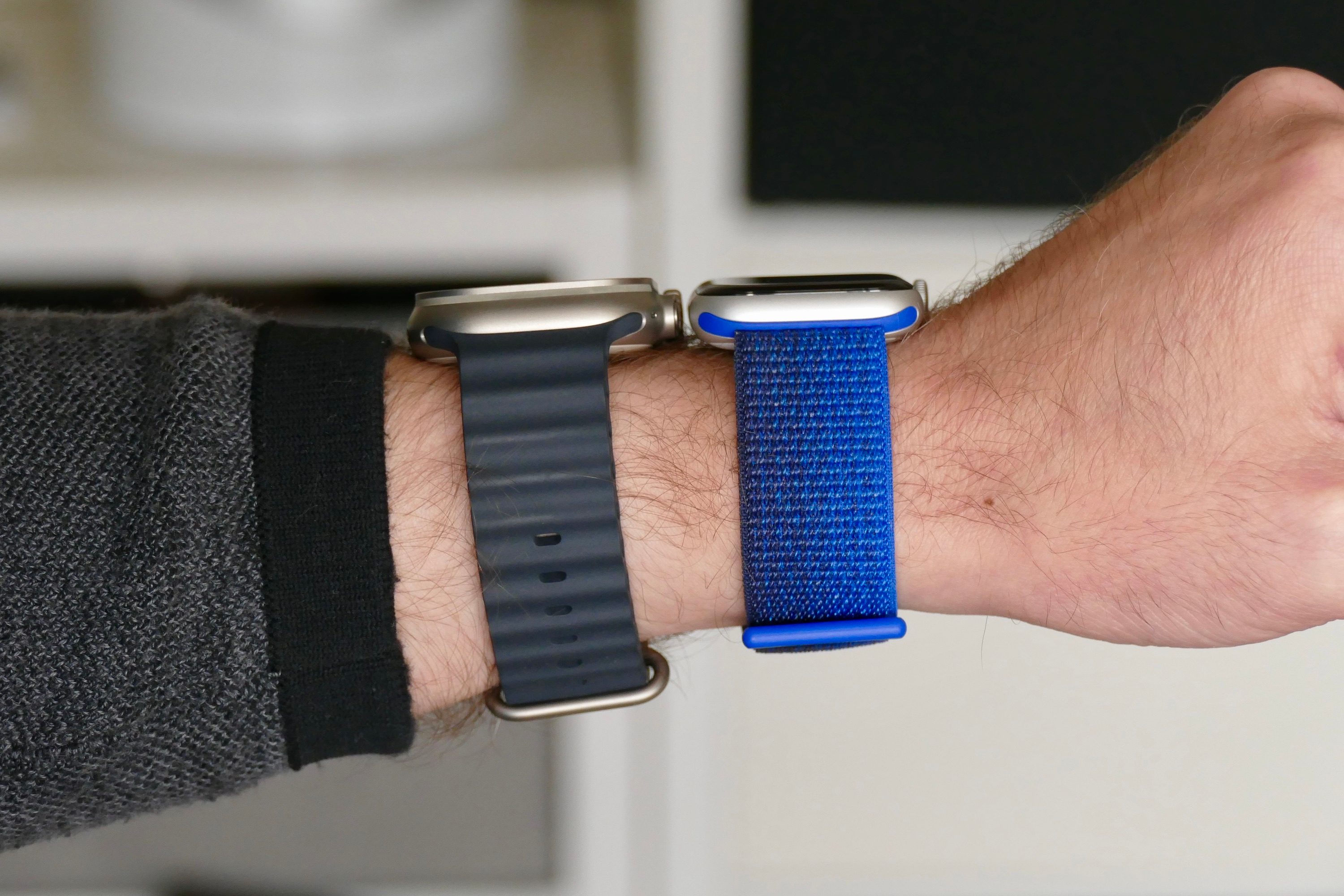 The Apple Watch Ultra and Apple Watch SE 2 from the side on a wrist.