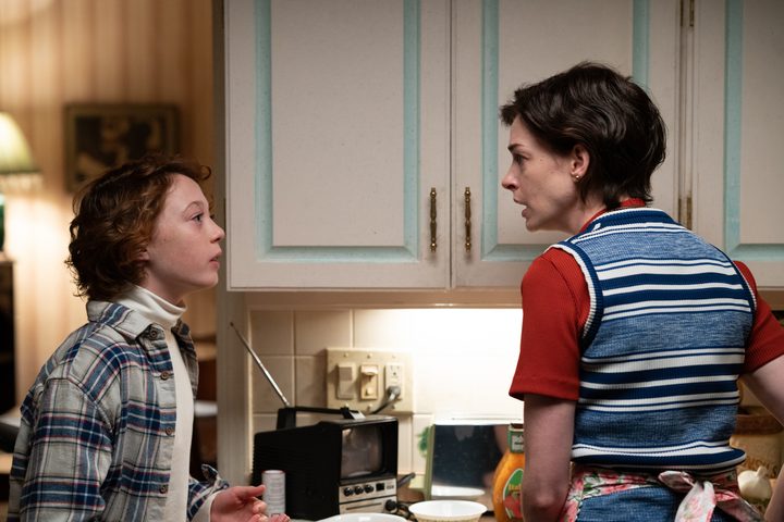 Banks Repeta and Anne Hathaway stand in a kitchen together in Armageddon Time.