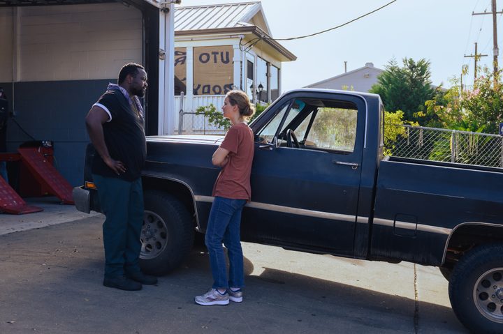 Brian Tyree Henry and Jennifer Lawrence stand next to a truck in Causeway.