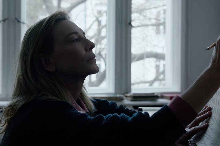Cate Blanchett writes on a music sheet in TÁR.