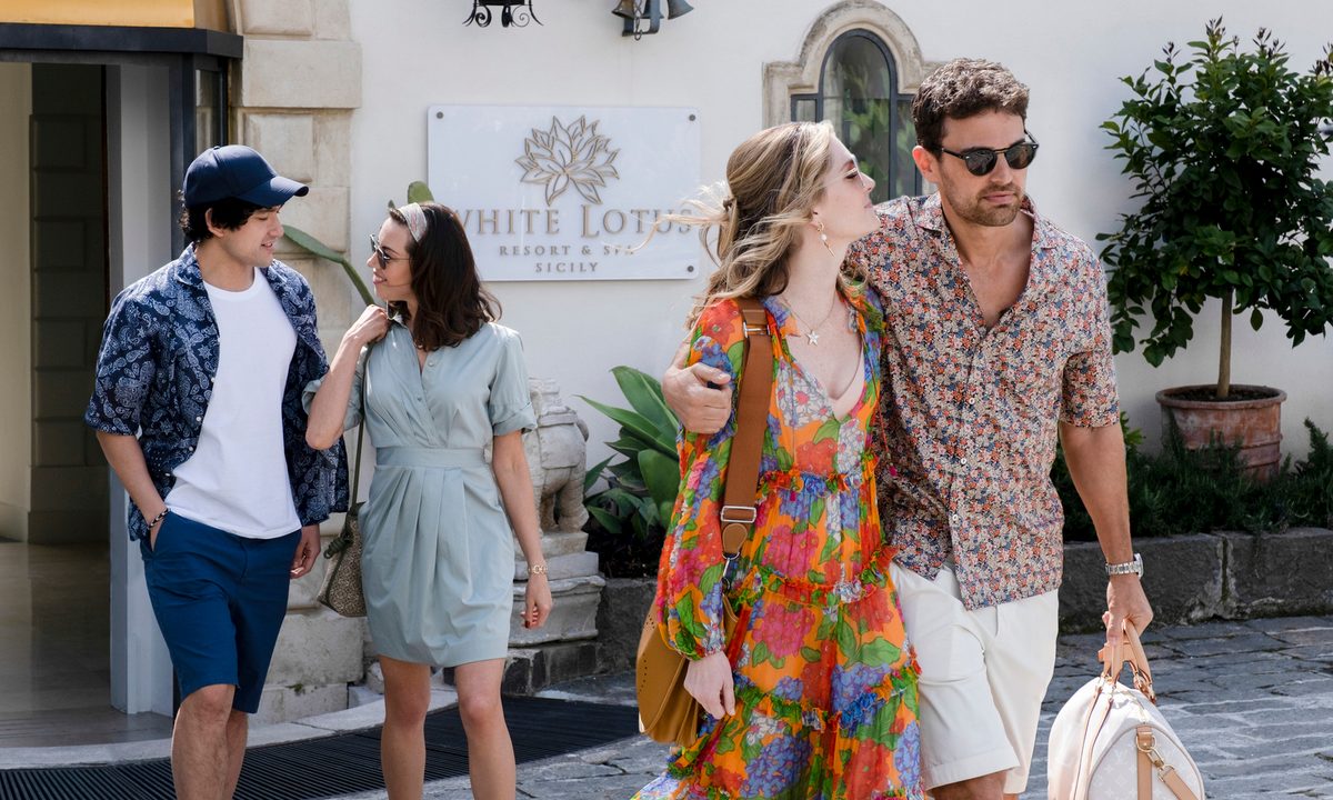 Ethan, Harper, Daphne, and Cameron walk out of their resort together in The White Lotus Season 2.