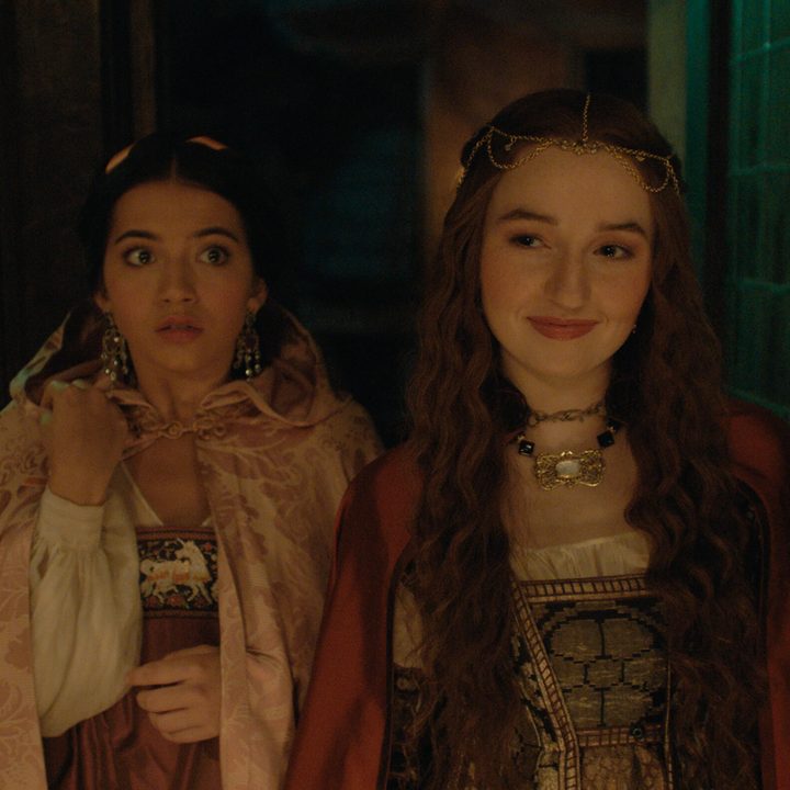 Isabela Merced stands next to Kaitlyn Dever in Hulu's Rosaline.