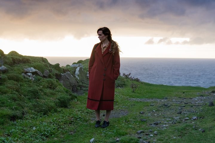 Kerry Condon stands on an Irish cliffside in The Banshees of Inisherin.