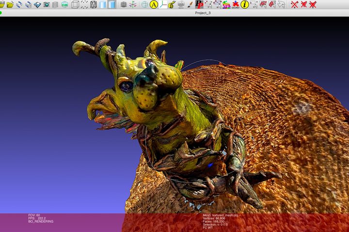 A Luma AI capture of an art figurine is being refined in MeshLab.