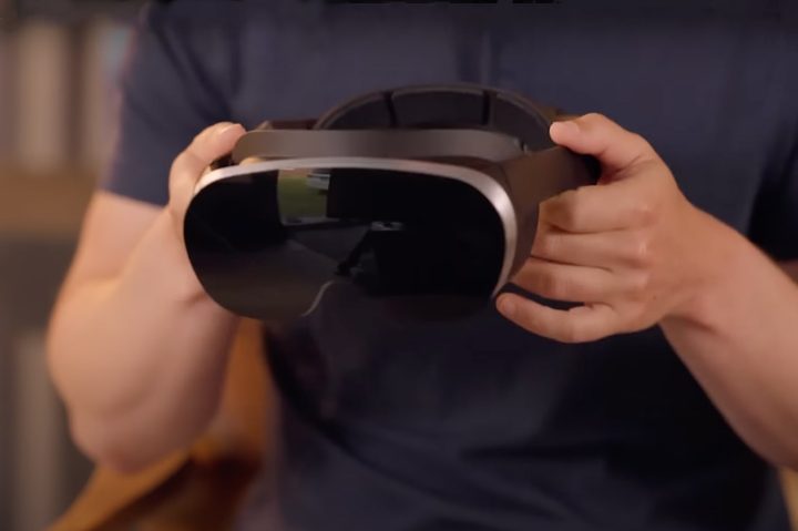 Mark Zuckerberg holds a thinner, lighter VR headset.