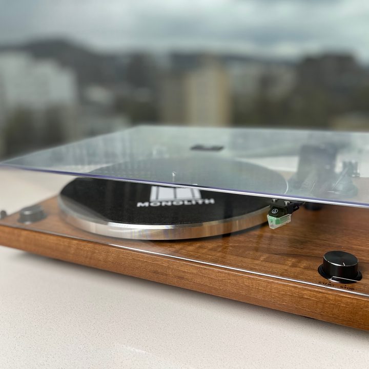 The monolith turntable with clear dustcover lowered.