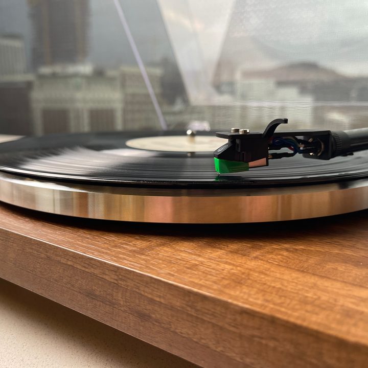 Closeup of the monolith turntable playing a record.