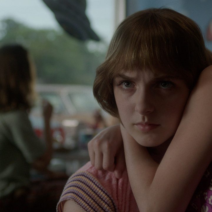 McKenna Grace with a disturbing look on her face in a scene from A Friend of the Family.