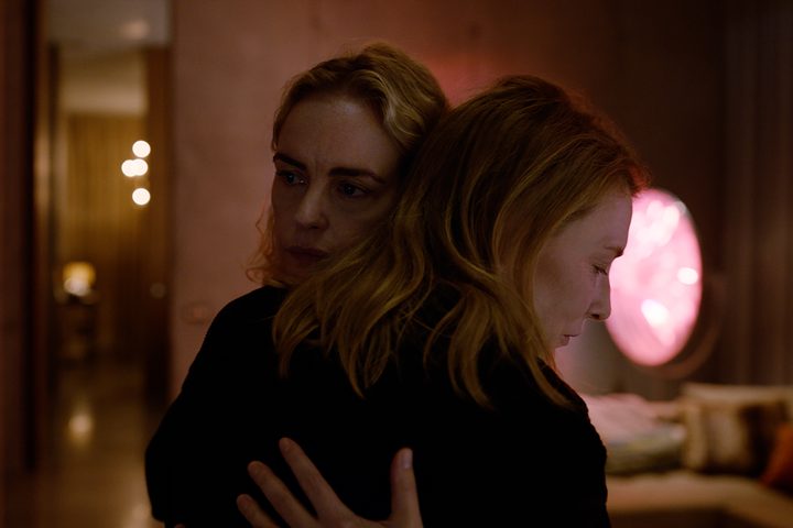 Nina Hoss and Cate Blanchett embrace each other in TÁR.
