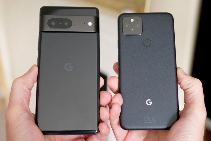 The Google Pixel 5 and Pixel 7 held in someone's hand.
