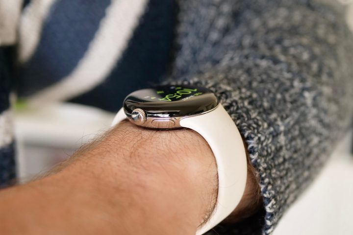 The side of the Google Pixel Watch, worn on a man's wrist.