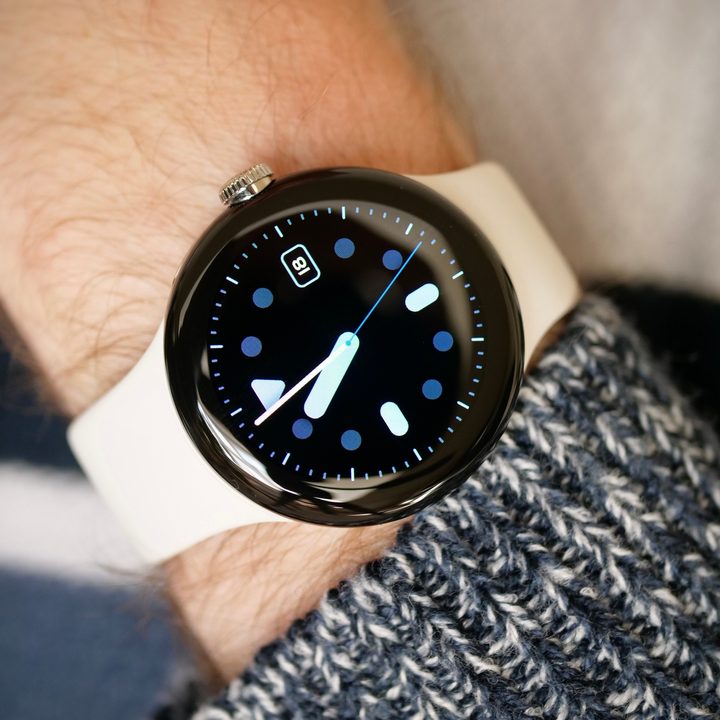 Google Pixel Watch worn on a man's wrist, showing the Pacific watch face.