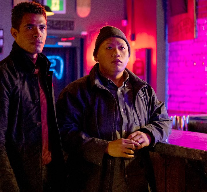 Mandela Van Peebles and Jacob Batalon stand next to each other in a scene from Reginald the Vampire.