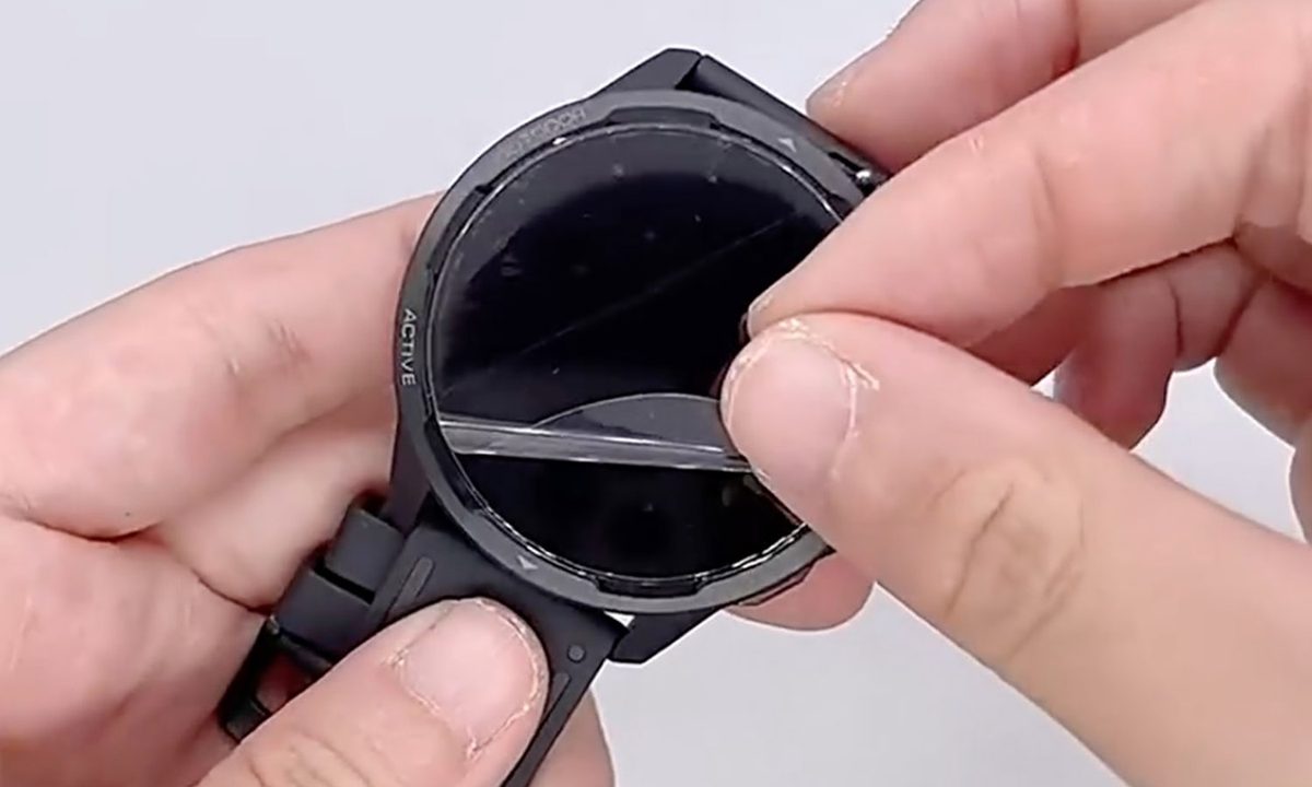 Someone applying a Screen Protector to Google Pixel Watch feat image.