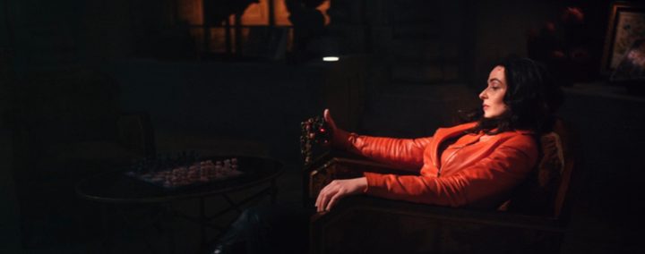 elsa-sitting-in-chair-wearing-red-coat-werewolf-by-night