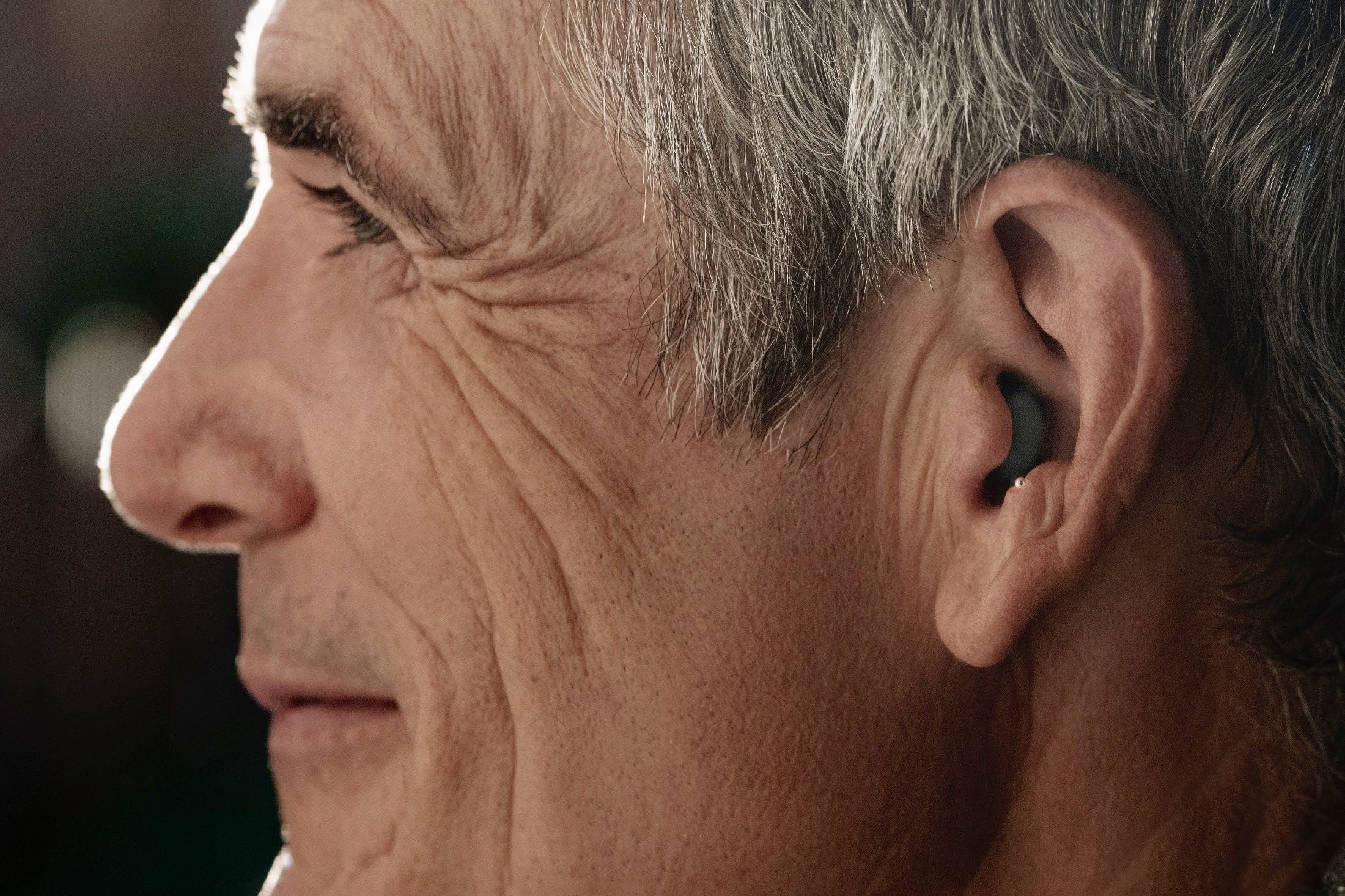 Man wearing Sony CRE-C10 OTC hearing aids.
