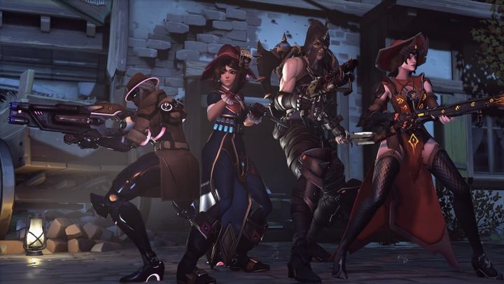 Soujourn, Kiriko, Junkerqueen, and Mercy posed together in their halloween costumes.